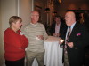 Ms. Simmons and Tommy Simmons talk with Dennis Poe as Mike McKay looks on