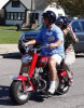 Mike and Deadri Horan riding on a vintage Cushman Scooter from the old days.